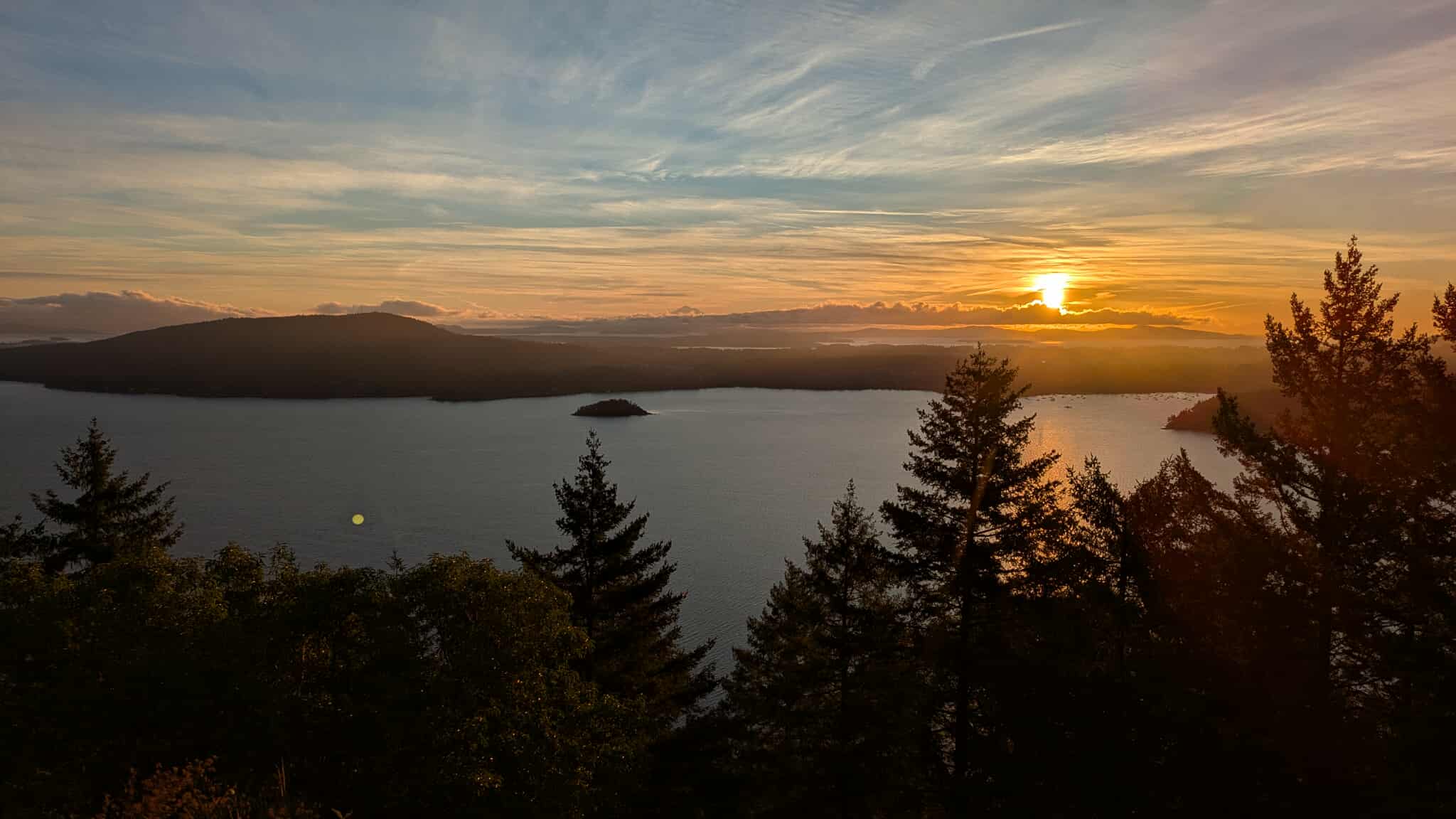 Sunset over mountains and lake