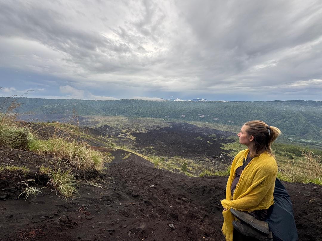 Tamara gazing over volcanic landscape in Bali